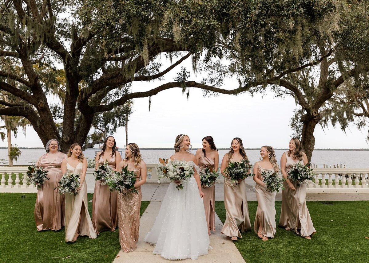 Bride with Bridesmaids walking on terrace at Bella Cosa, Lake Wales, Florida