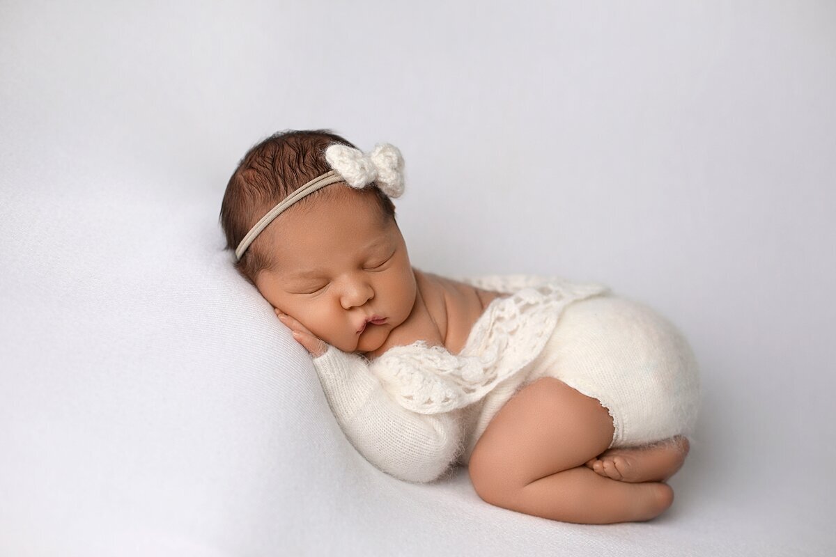 newborn girl with flower headband