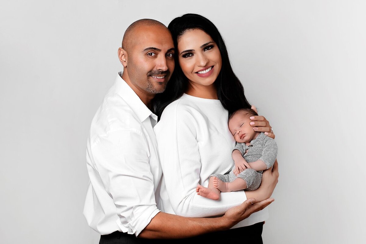 Vancouver studio family photos of mother, father and newborn baby boy.