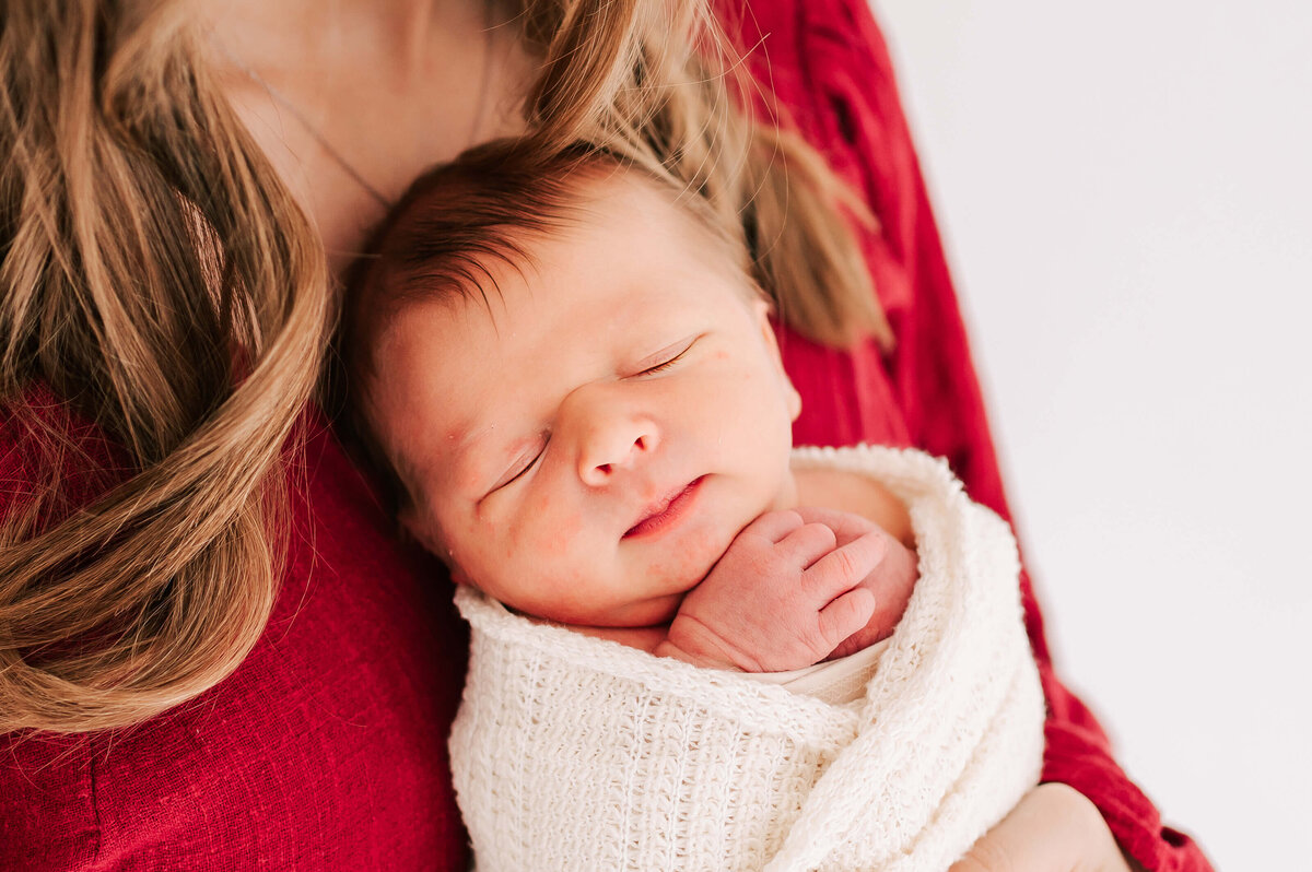 Springfield Mo newborn photography of sleeping baby boy on moms chest