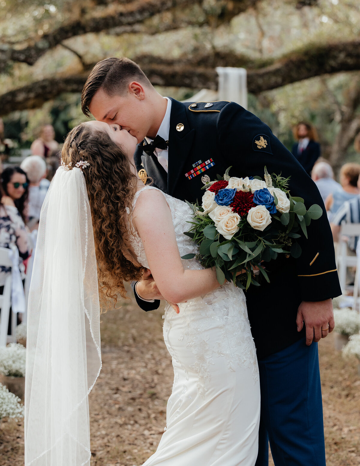 Bride and Groom Kissing at end of the aisle