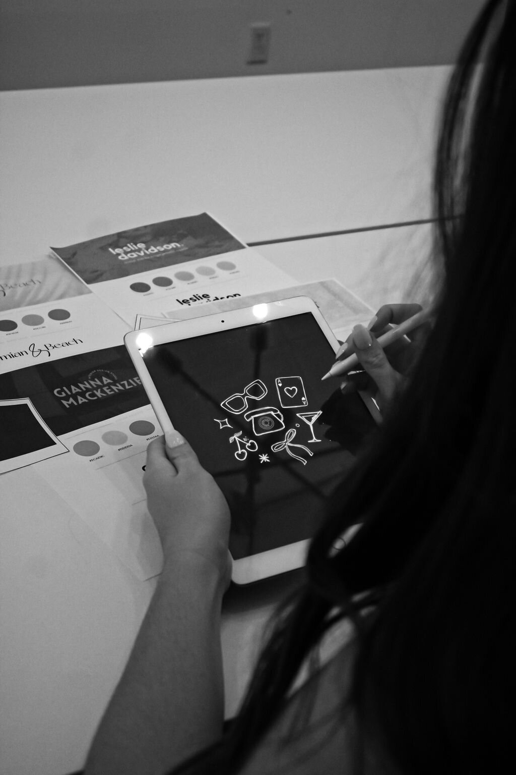 Black and White Image of Leilah Drawing on Tablet