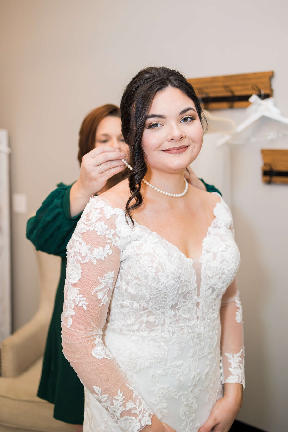 Bride having necklace put on at at wedding at Mahr Park Arboretum, Tennessee