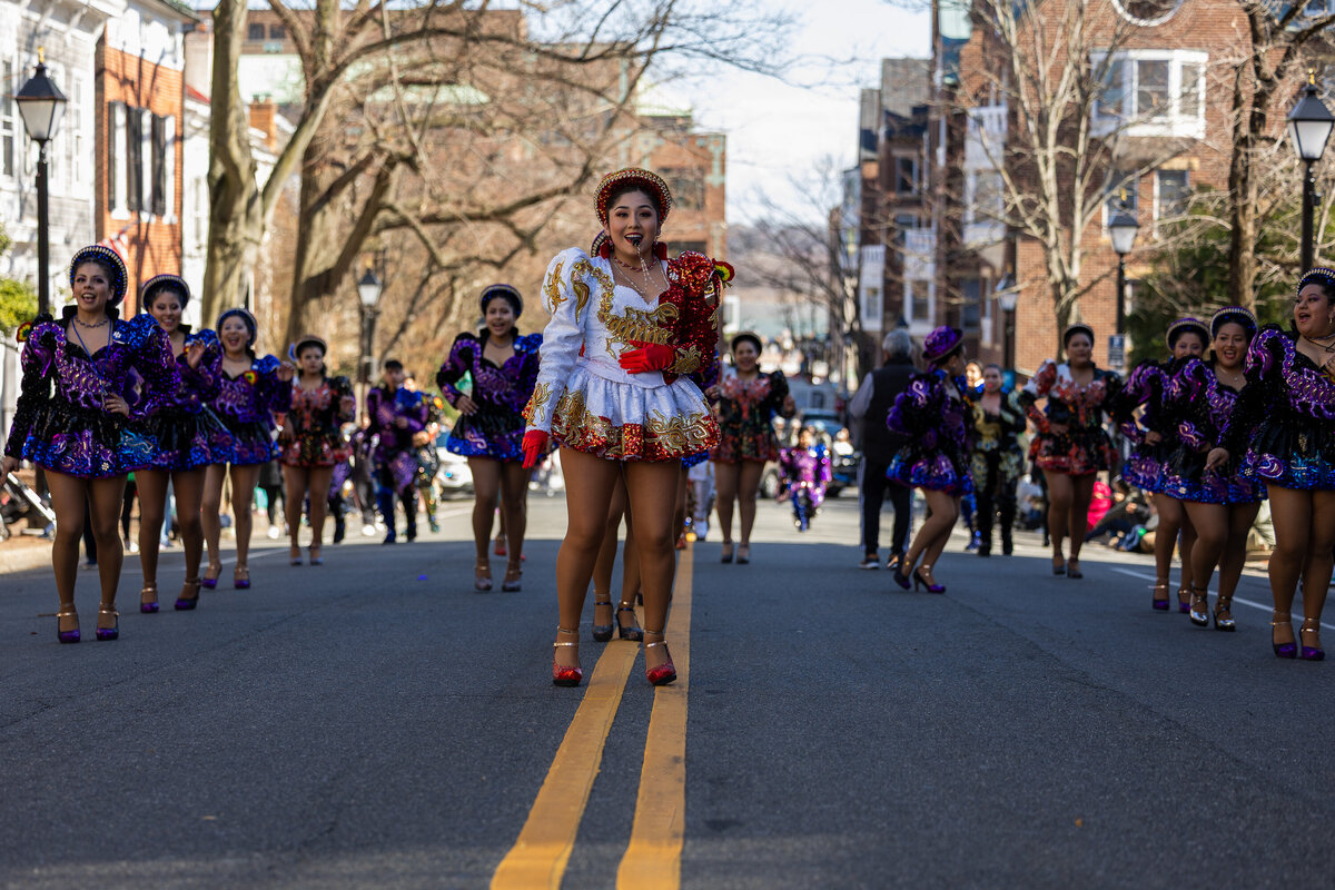 Vibrant Group of dancers in the streets of Alexandria, Va, during a multi cultural parade captured by event photographer Branden Gonzalez of Brandgo Photography 