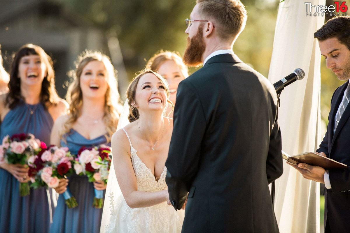 Groom makes Bride laugh during ceremony