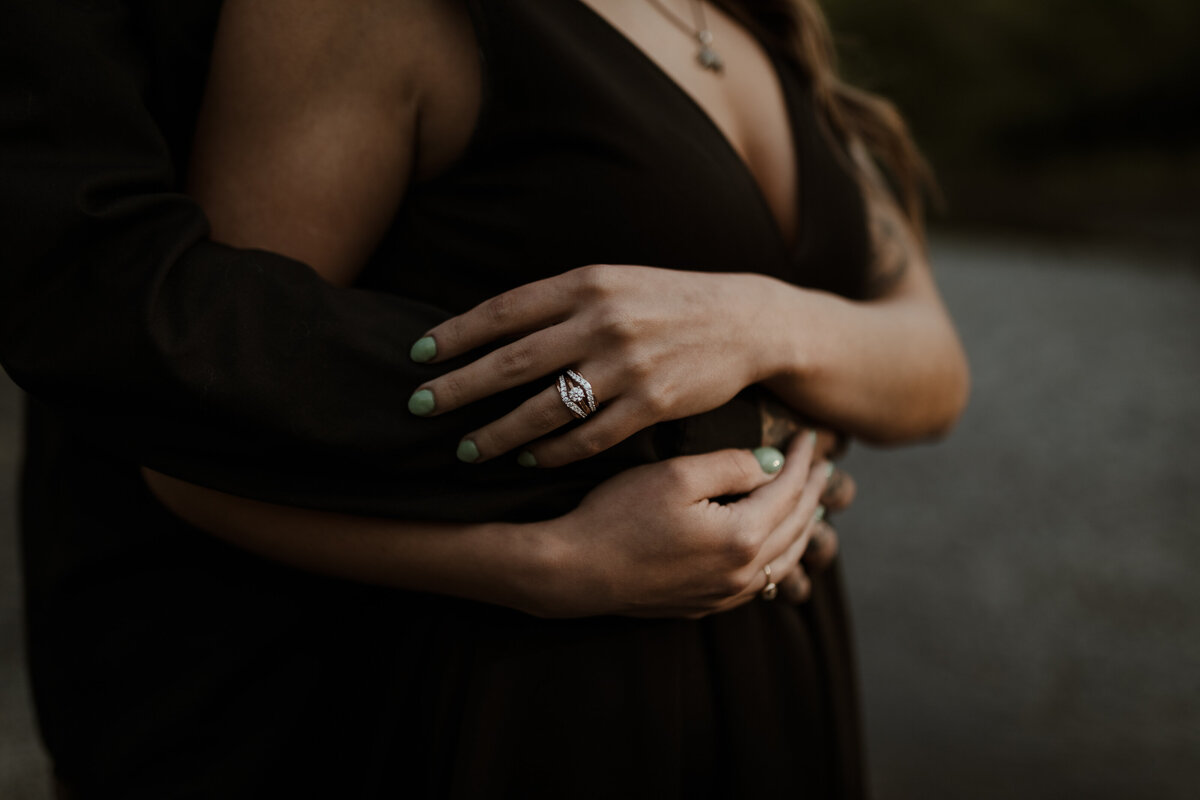 hand with engagement ring