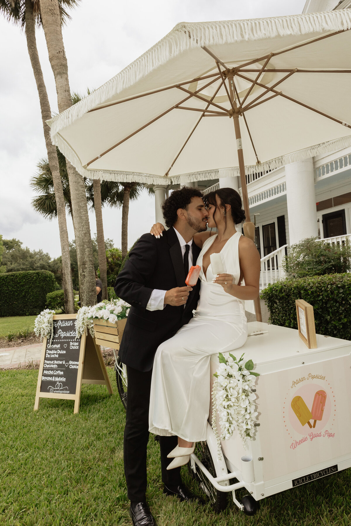 Charming pastel popsicle cart at a Florida wedding reception at The Palm Mansion