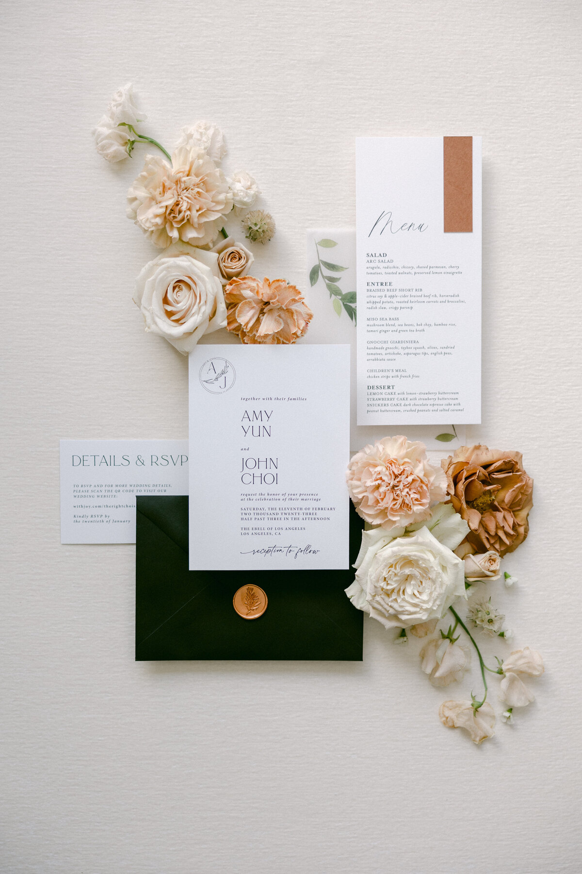 Flatlay image of wedding invitation suite