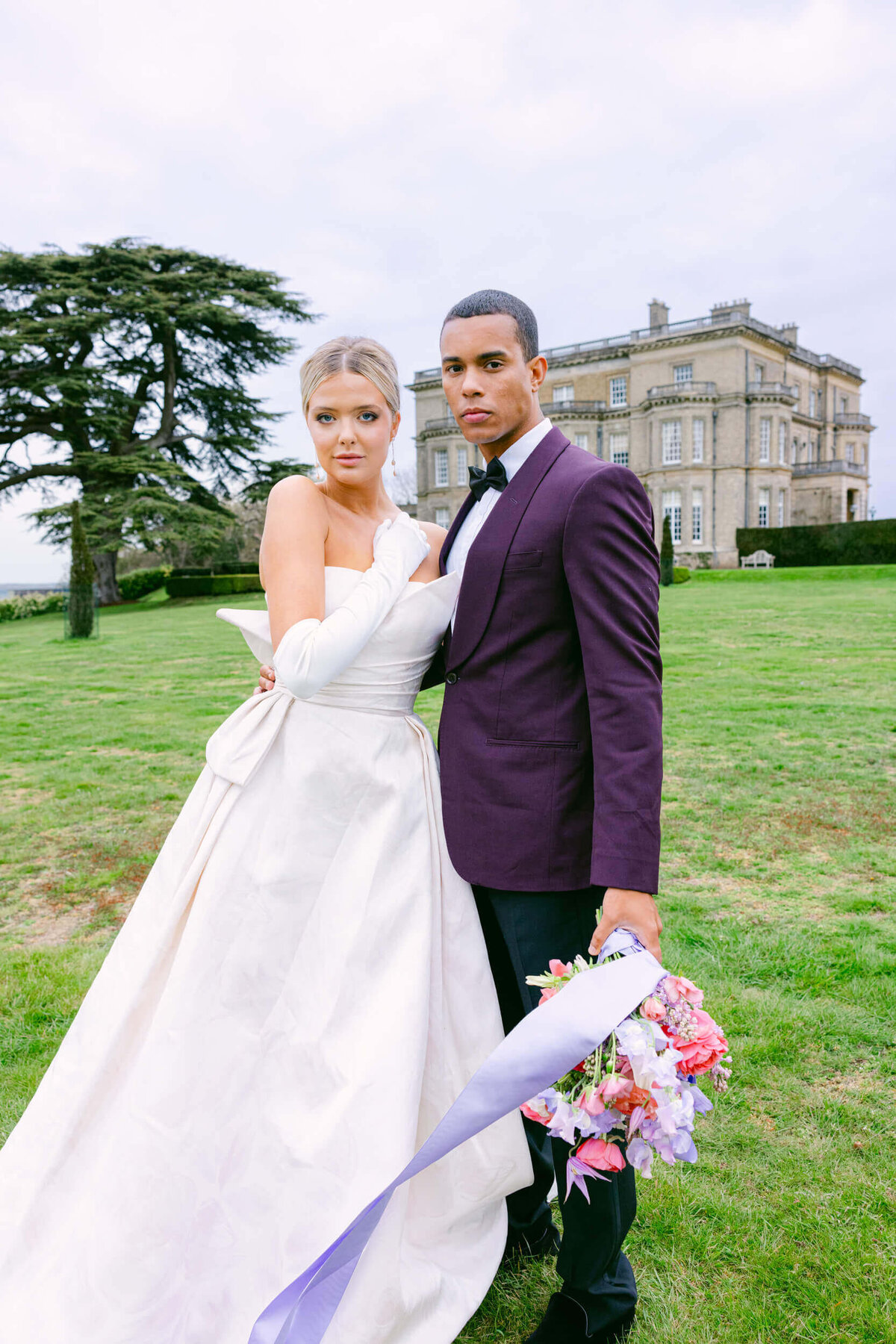 A wedding day photo of the bride and groom at Hedsor House in the Uk
