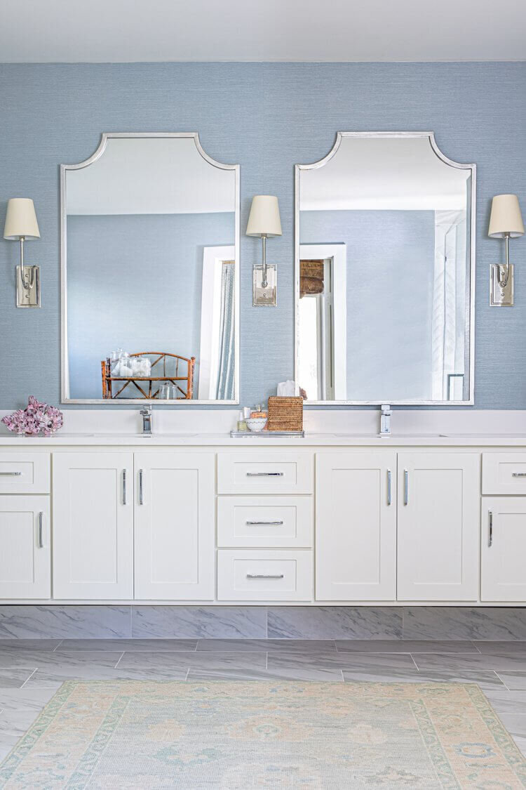 oyster creek studios highland park home blue bathroom with double white vanity and silver hardware
