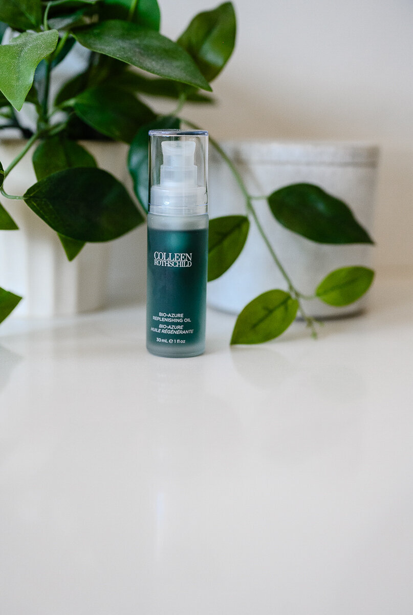 A denver commercial photographer takes beauty product photos for a branding photography session of a green bottle of colleen rothschild beauty  products for brand pictures and brand photos.
