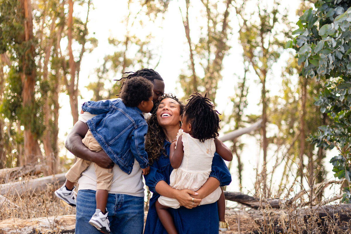 Loving family cuddles outdoors during Bay Area Family Portfolio session – Ellobelle Photography