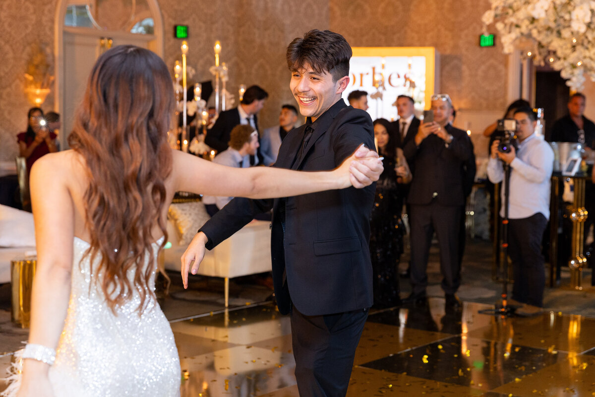 groom dancing with his bride to be