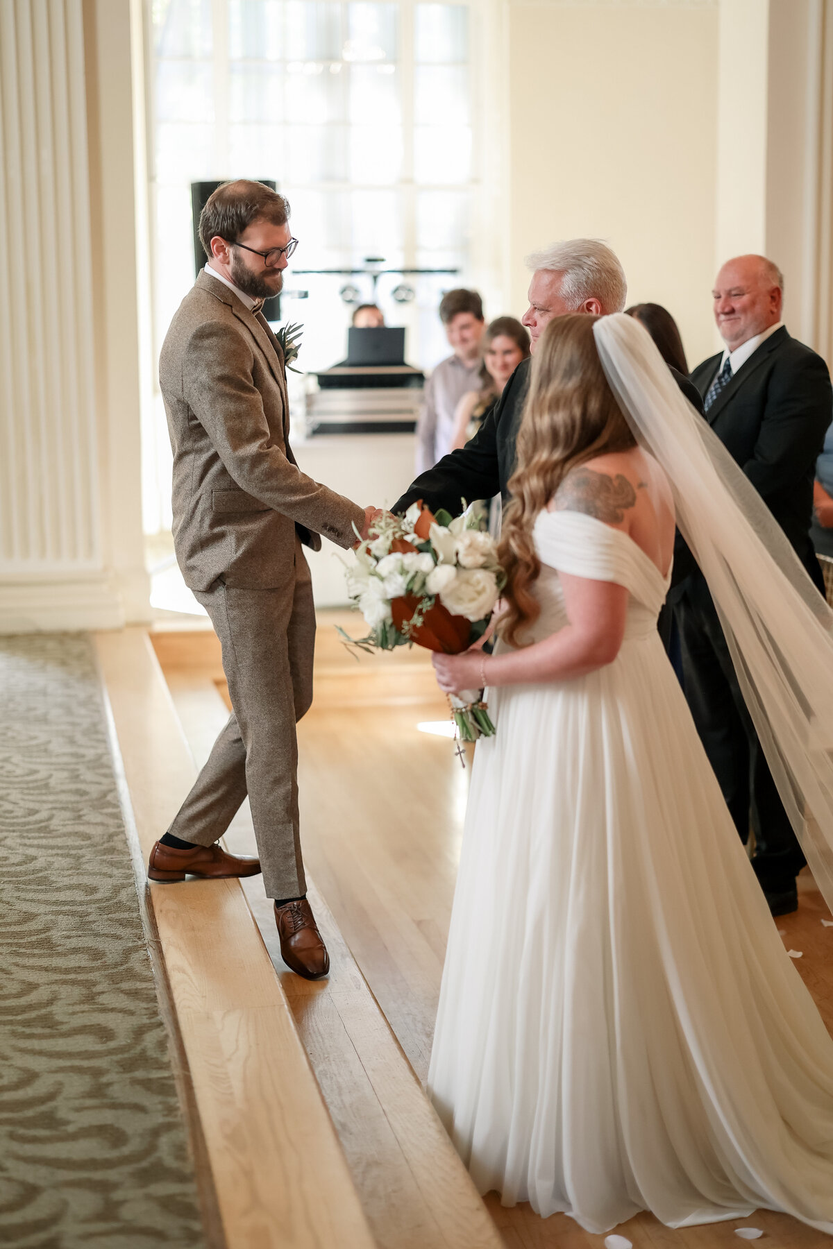 A beautiful wedding day featuring the bride and groom, joyful moments with family and friends, elegant decor, and heartfelt celebrations in a stunning venue.