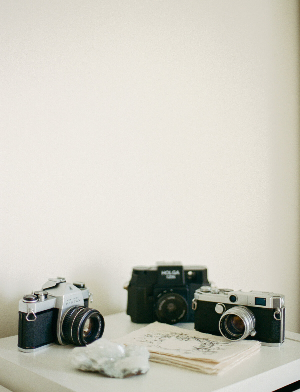 workspace of film branding photographer in Michigan, vintage film cameras, holga