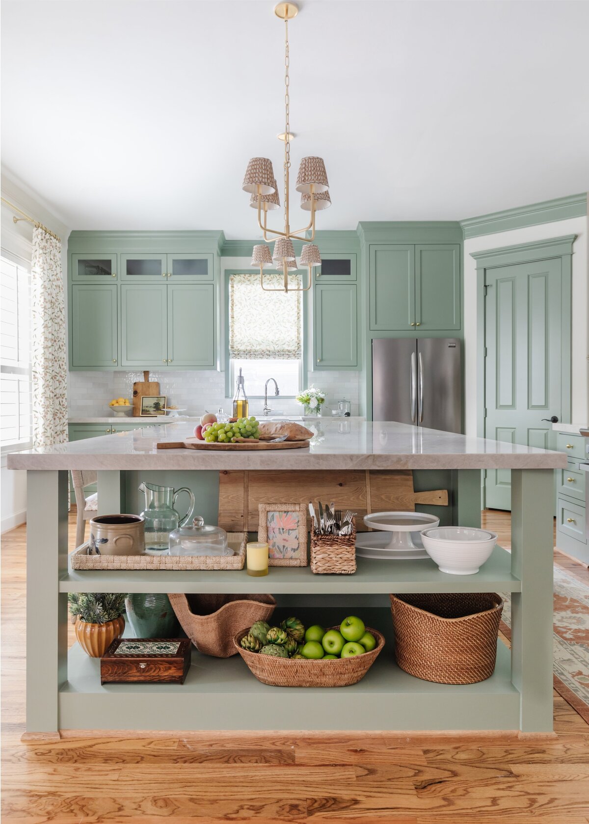 oyster creek studios oak forest remodel light sage shelving with wicker baskets in kitchen