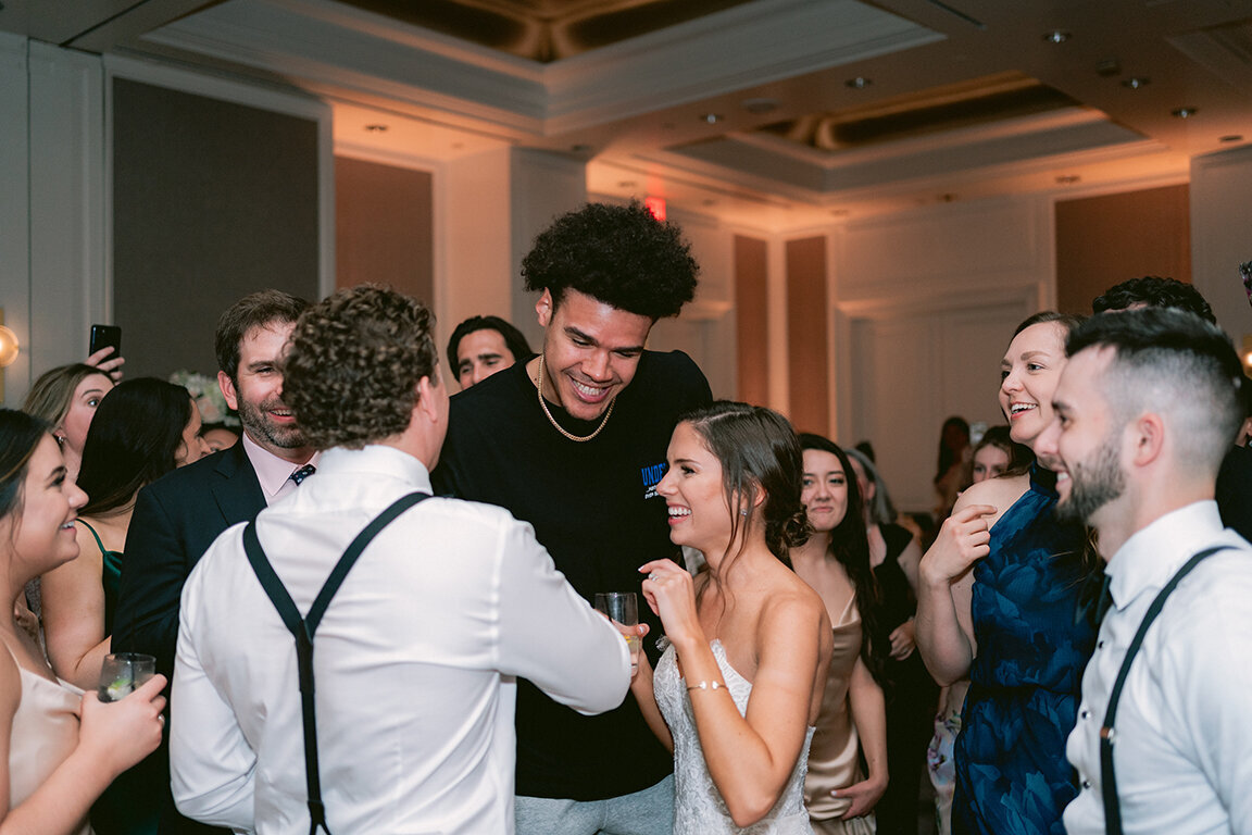 Wedding guests enjoying wedding reception at Hotel Crescent Court, Dallas