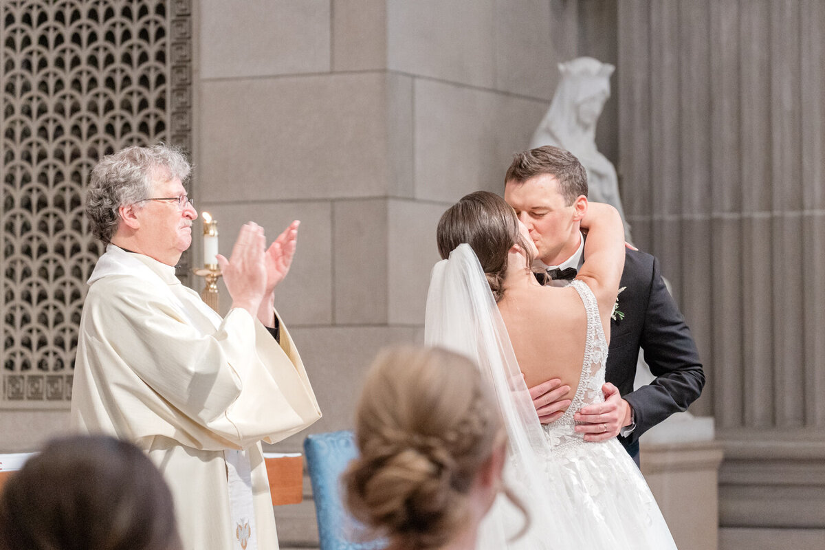 Abride and groom share their first kiss as a married couple