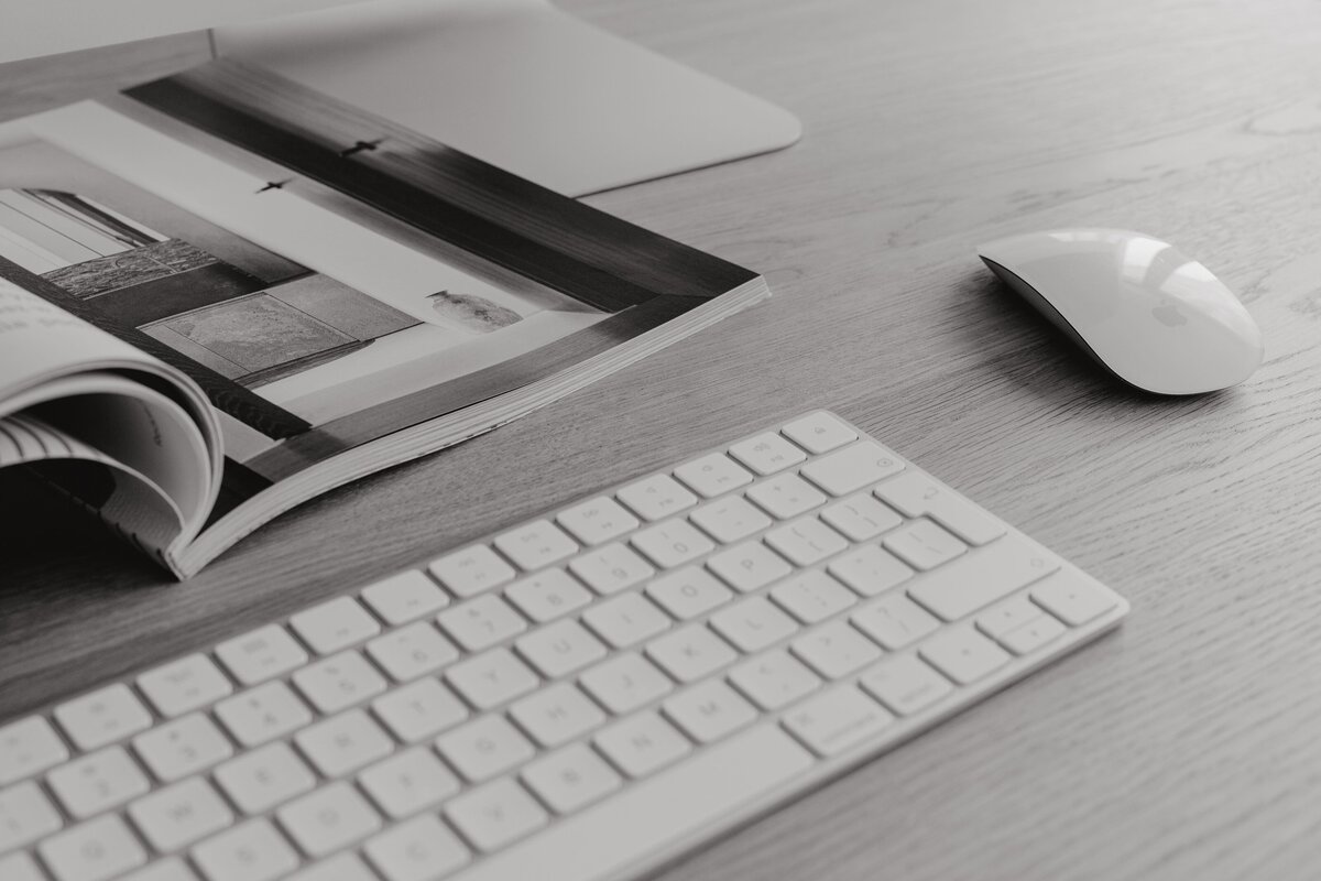 keyboard and magazine on desk