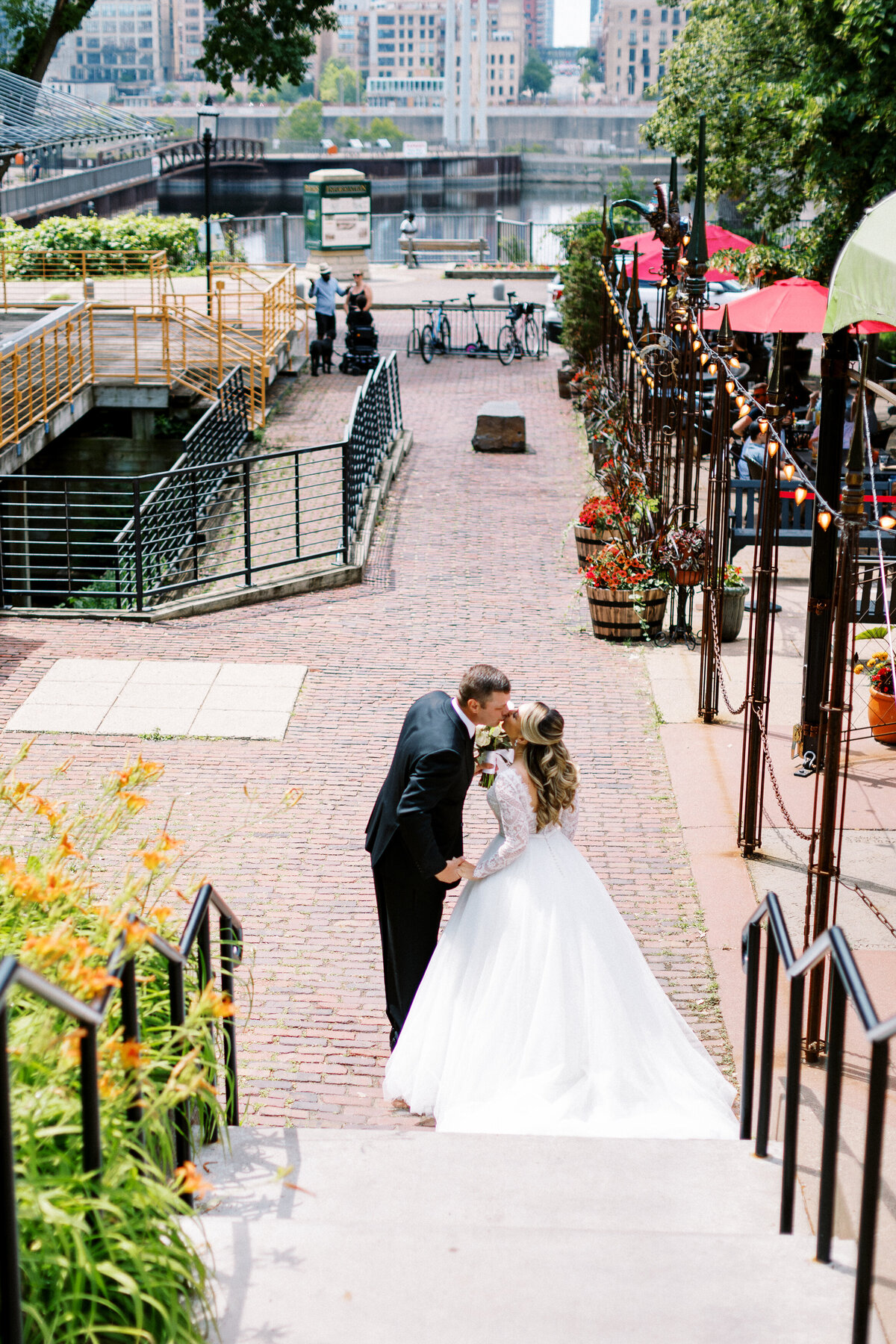 bride and groom kissing at Aster Cafe wedding