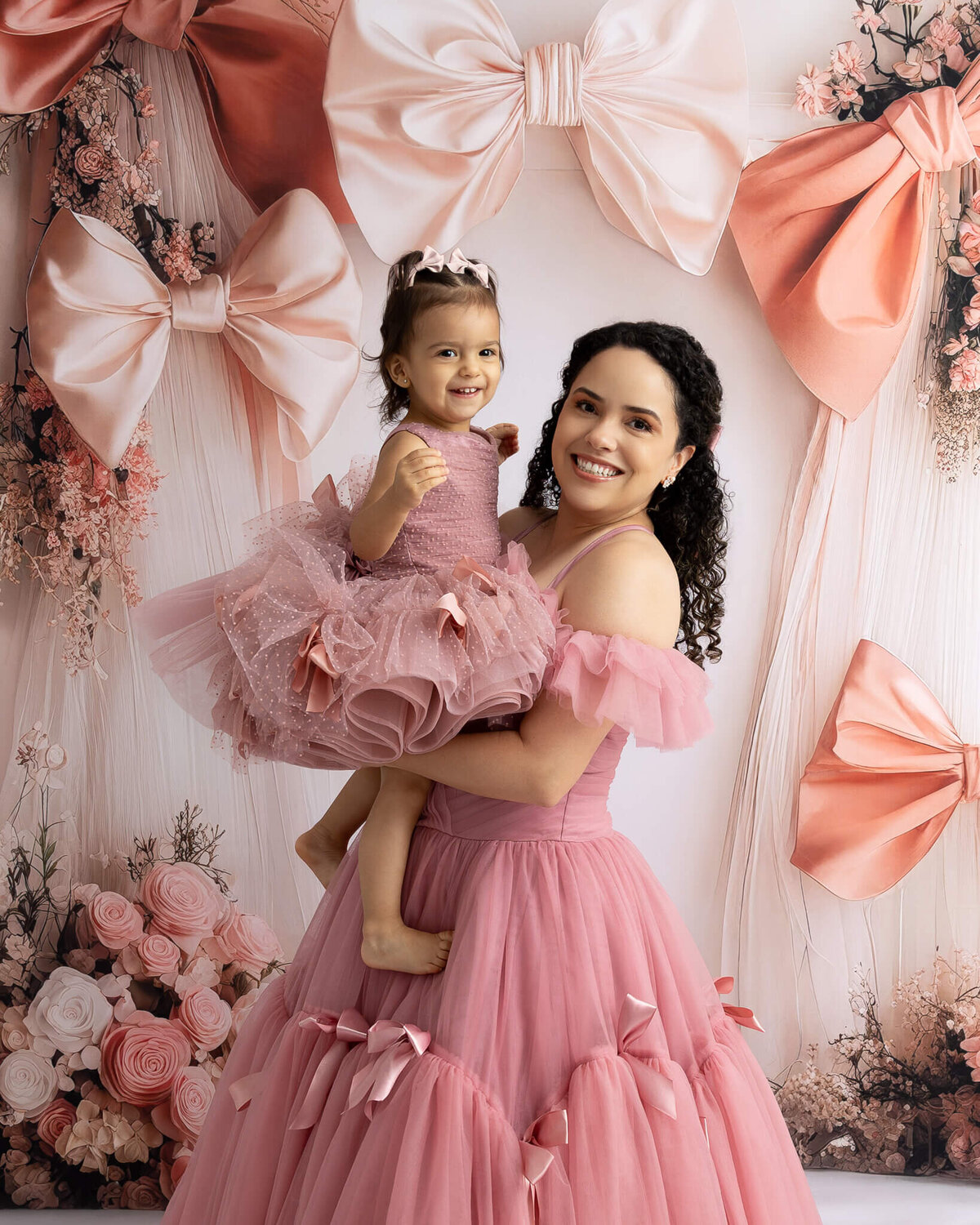 mother and daughter in matching couture gowns for mommy and me session in la vernia