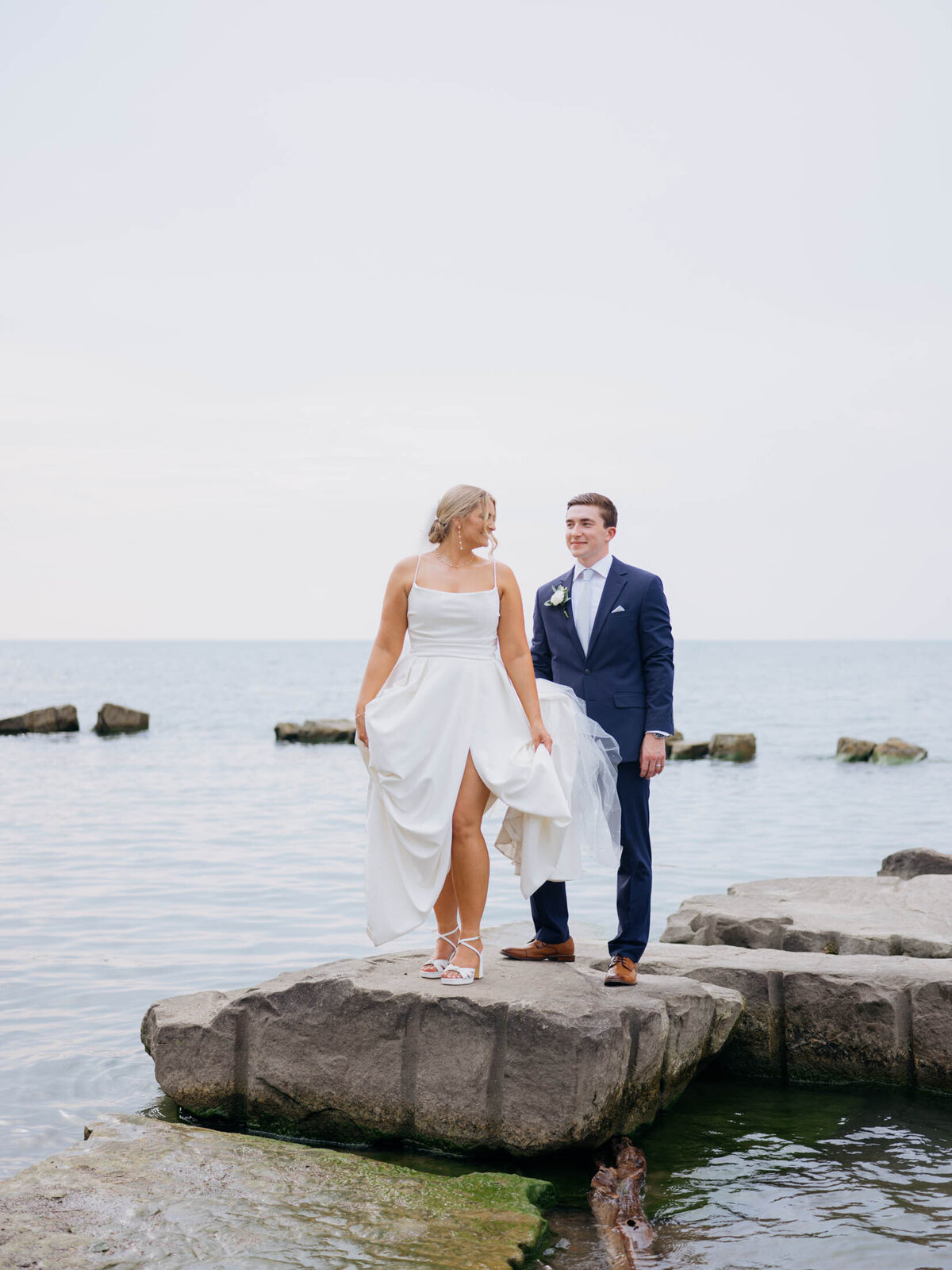 Bride and groom with lake in the background at Cleveland Yachting Club