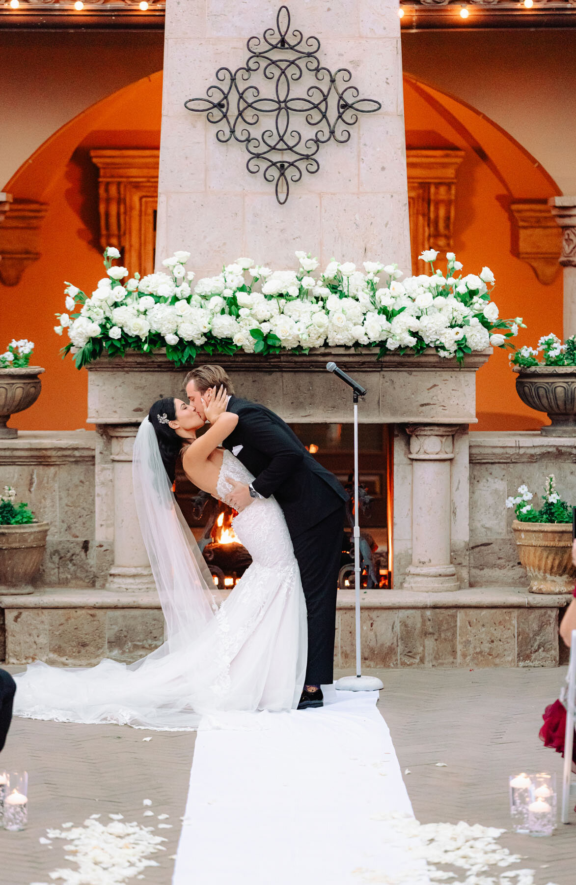 Wedding ceremony at Villa Siena Phoenix outdoor courtyard with stone archways