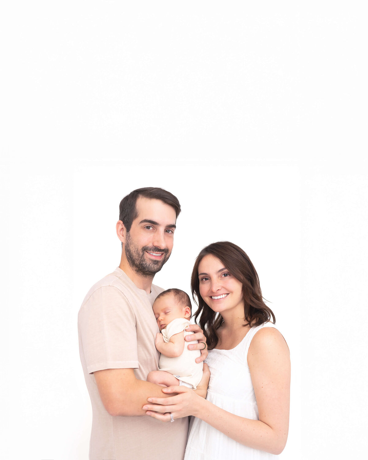 adorable one year old baby in white sitting in white bowl with white studio background