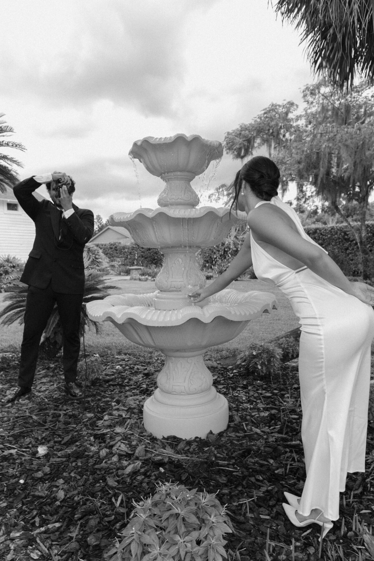 Luxury Florida wedding surrounded by tall palm trees and tropical details at The Palm Mansion in Umatilla