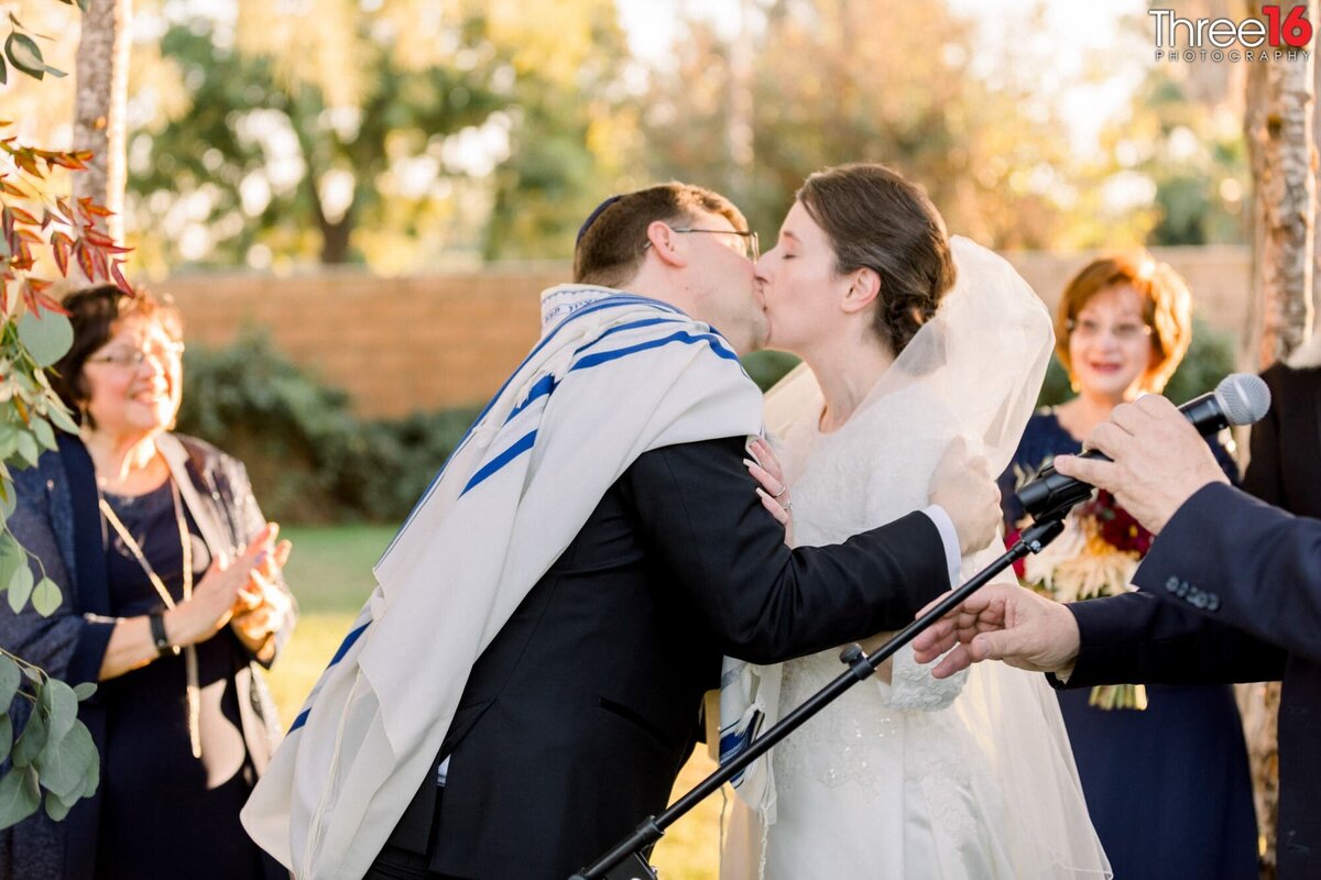 Bride and Groom share their first kiss as a married couple