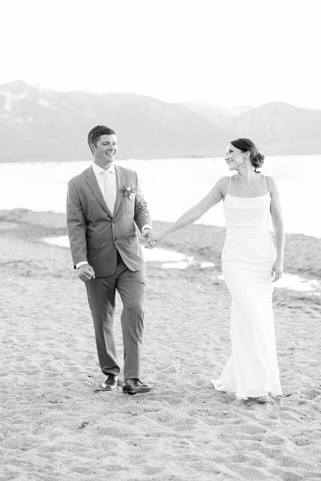 Couple walking on Tahoe beach