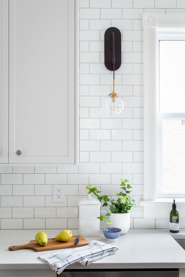 White Subway tiles - black wall sconce