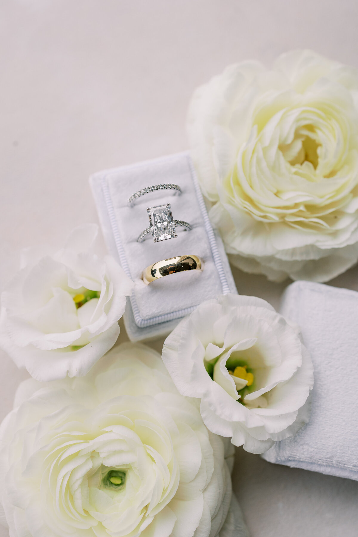 Wedding ring and white roses detail photography