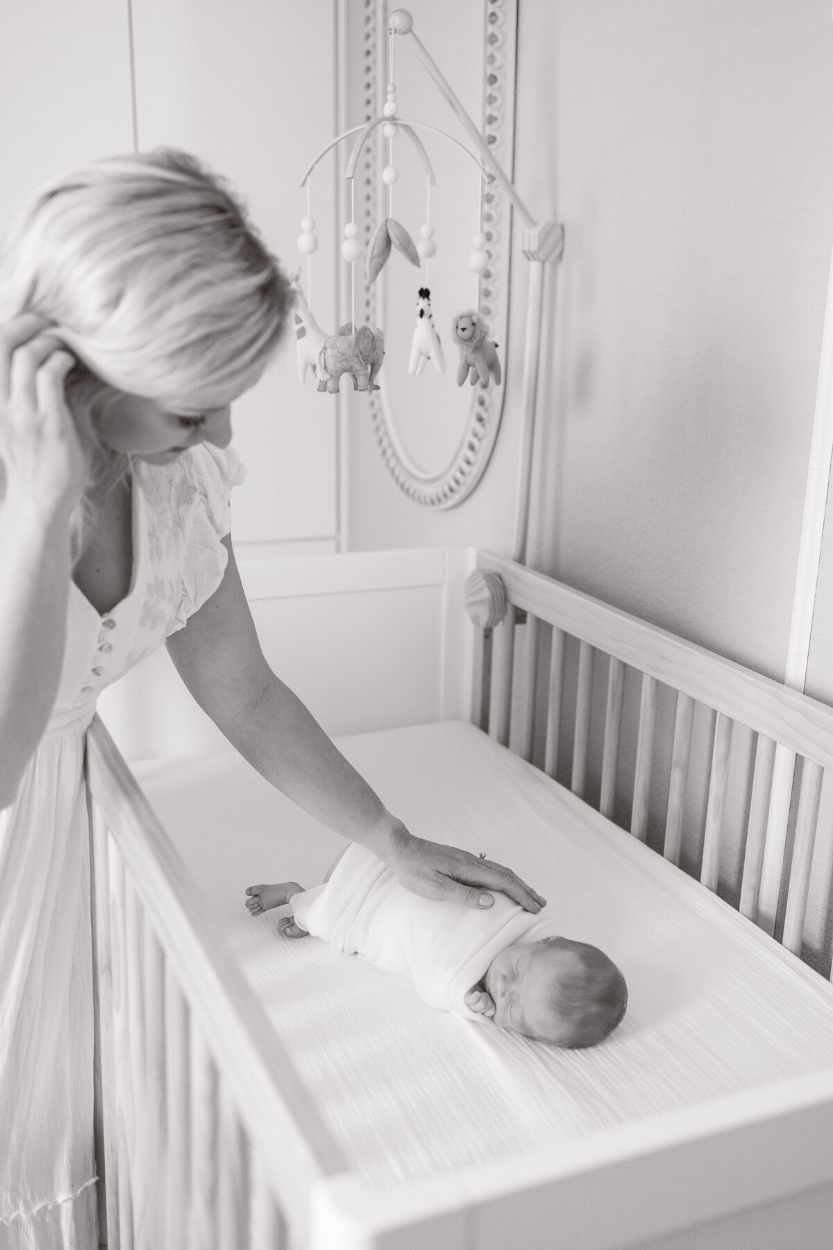 mom-holding-baby-boy-newborn-photos-at-home-virginia-beach