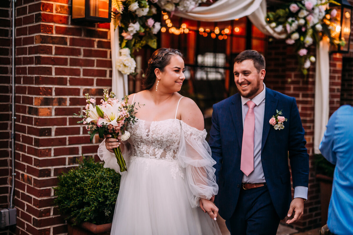 Wedding-Couple-Walking-at-reception