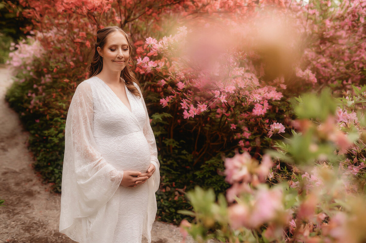 Pregnant woman poses for Maternity Photos at Biltmore Estate in Asheville, NC.