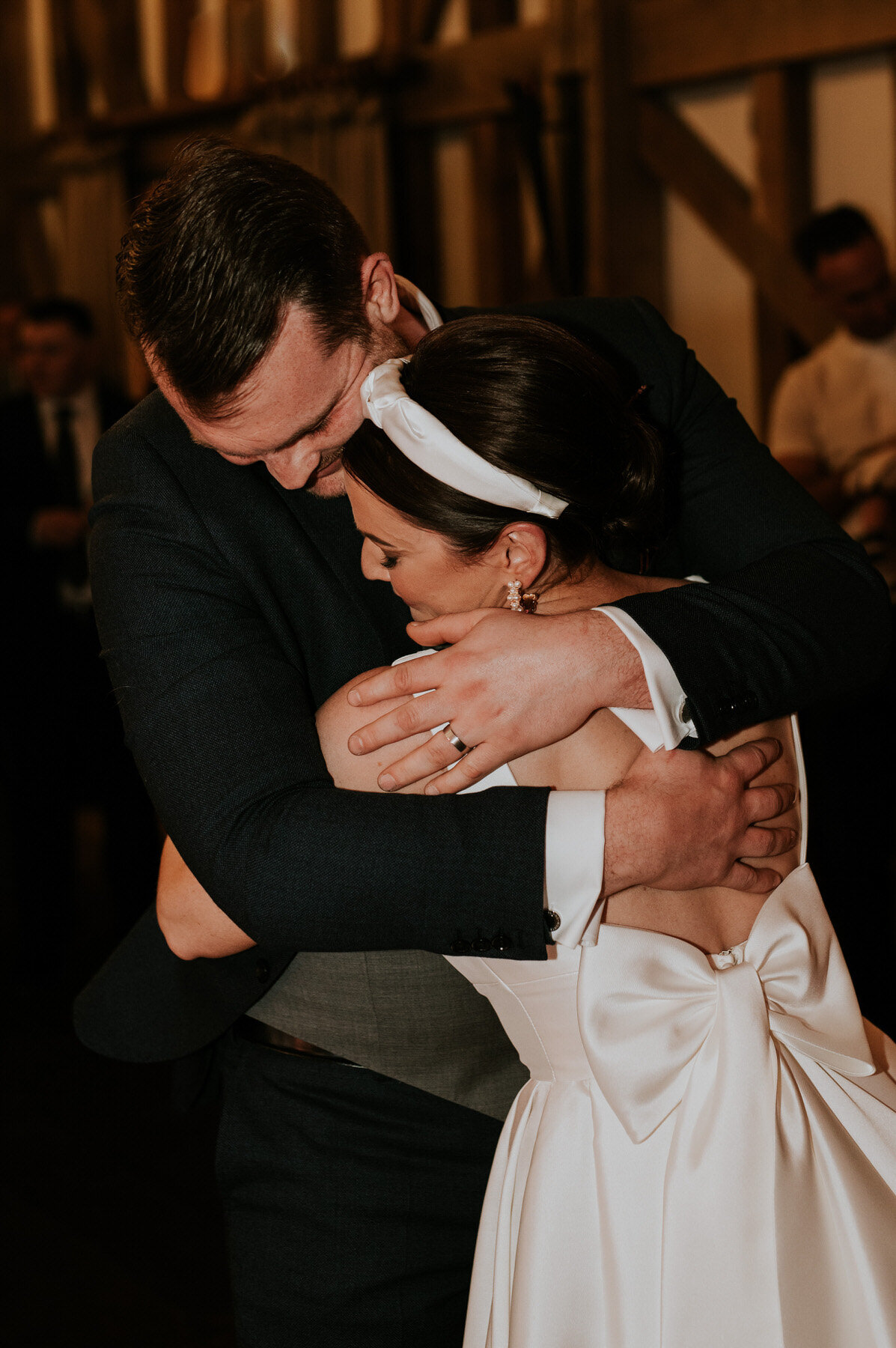 bride and groom hugging on the dancefloor