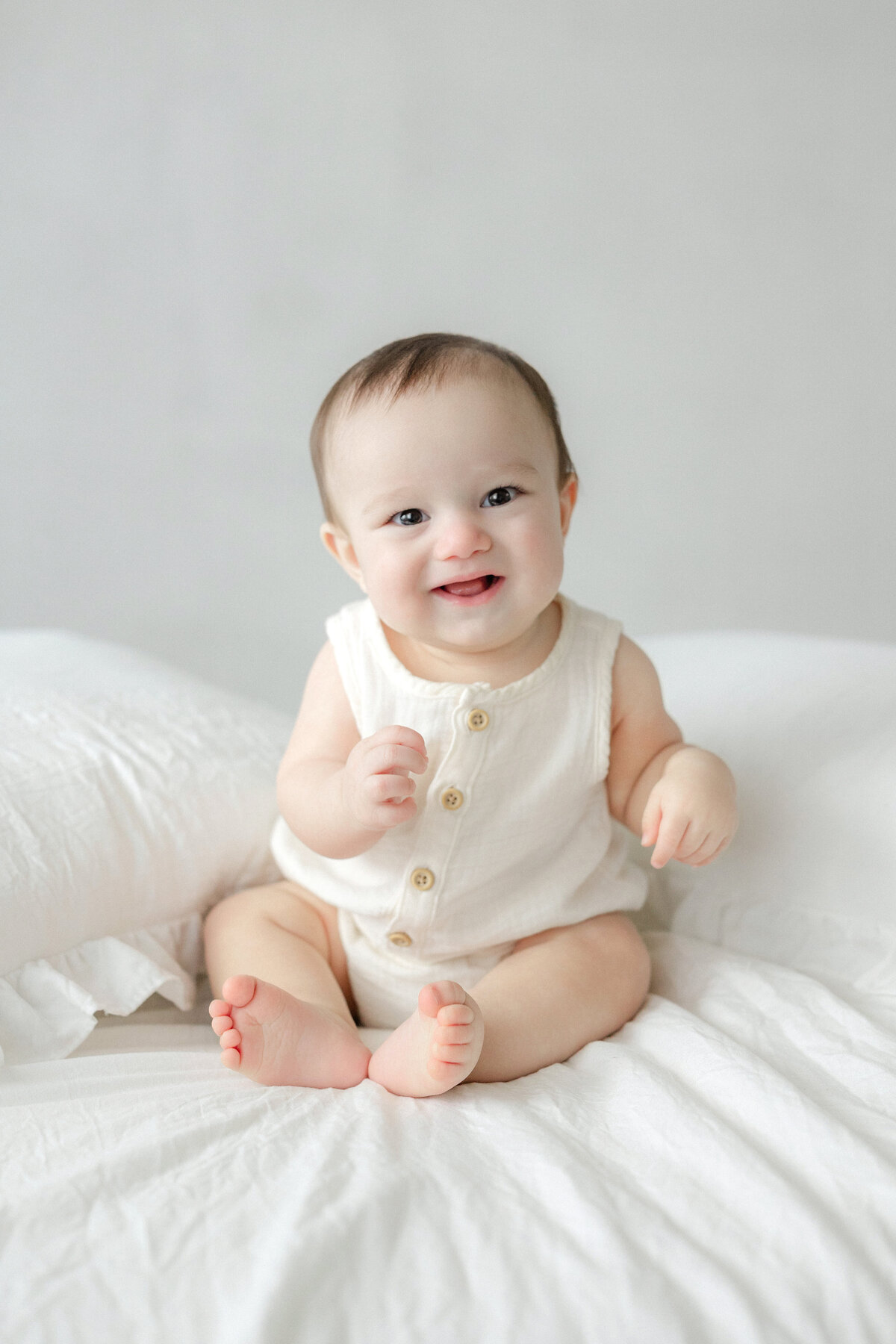 Tampa 6-month milestone portrait of smiling baby boy in natural light studio