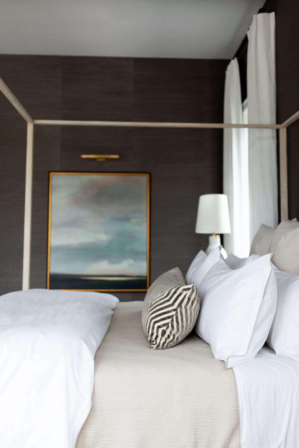 oyster creek studios building belt new build tan canopy bed and landscape painting in bedroom