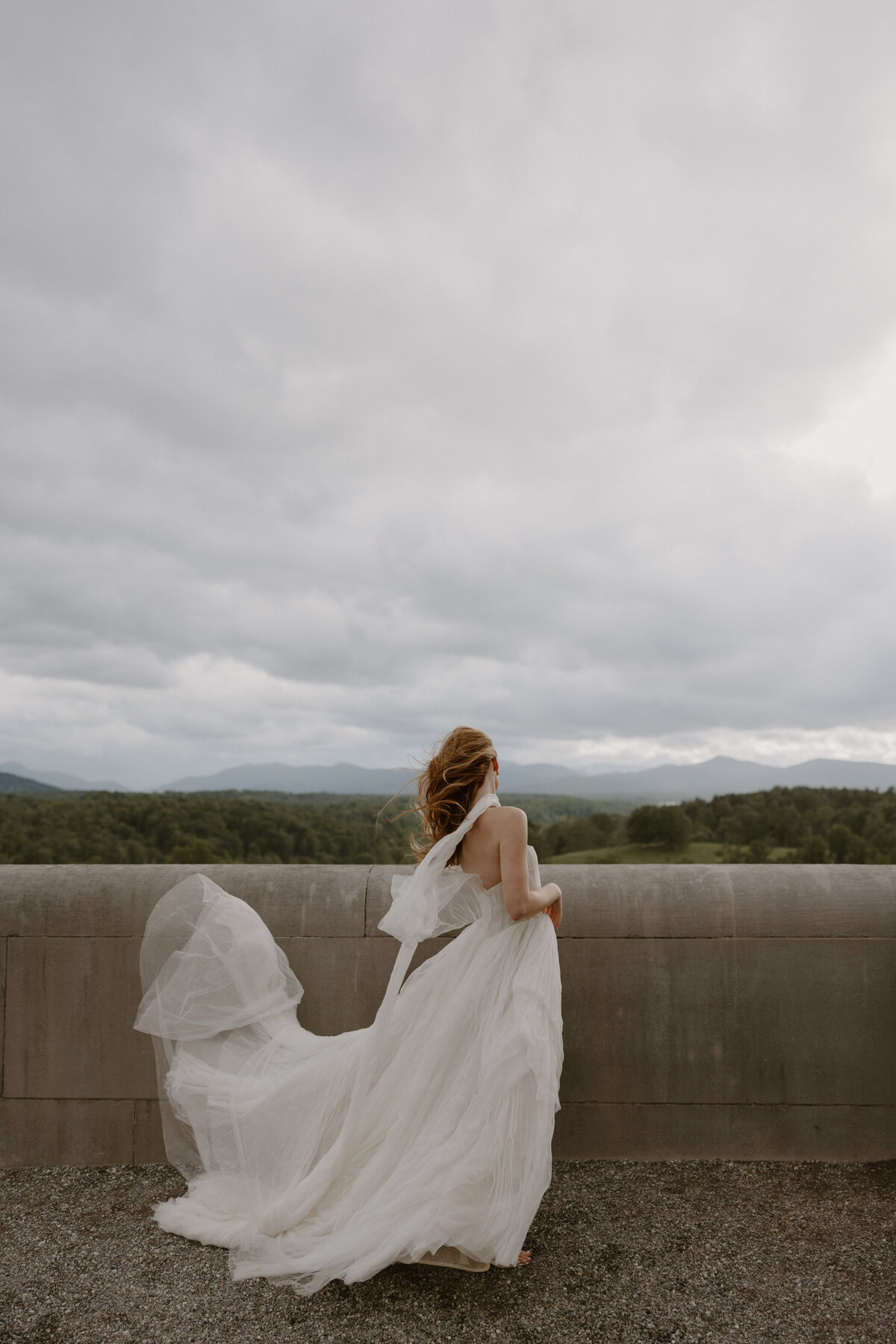 Dreamy Biltmore Estate bridal photo with soft mountain backdrop and ethereal tulle gown.