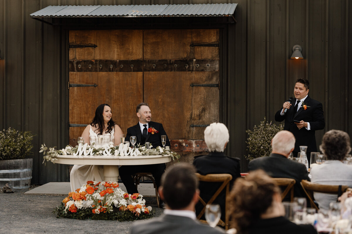 Man giving speech at wedding reception