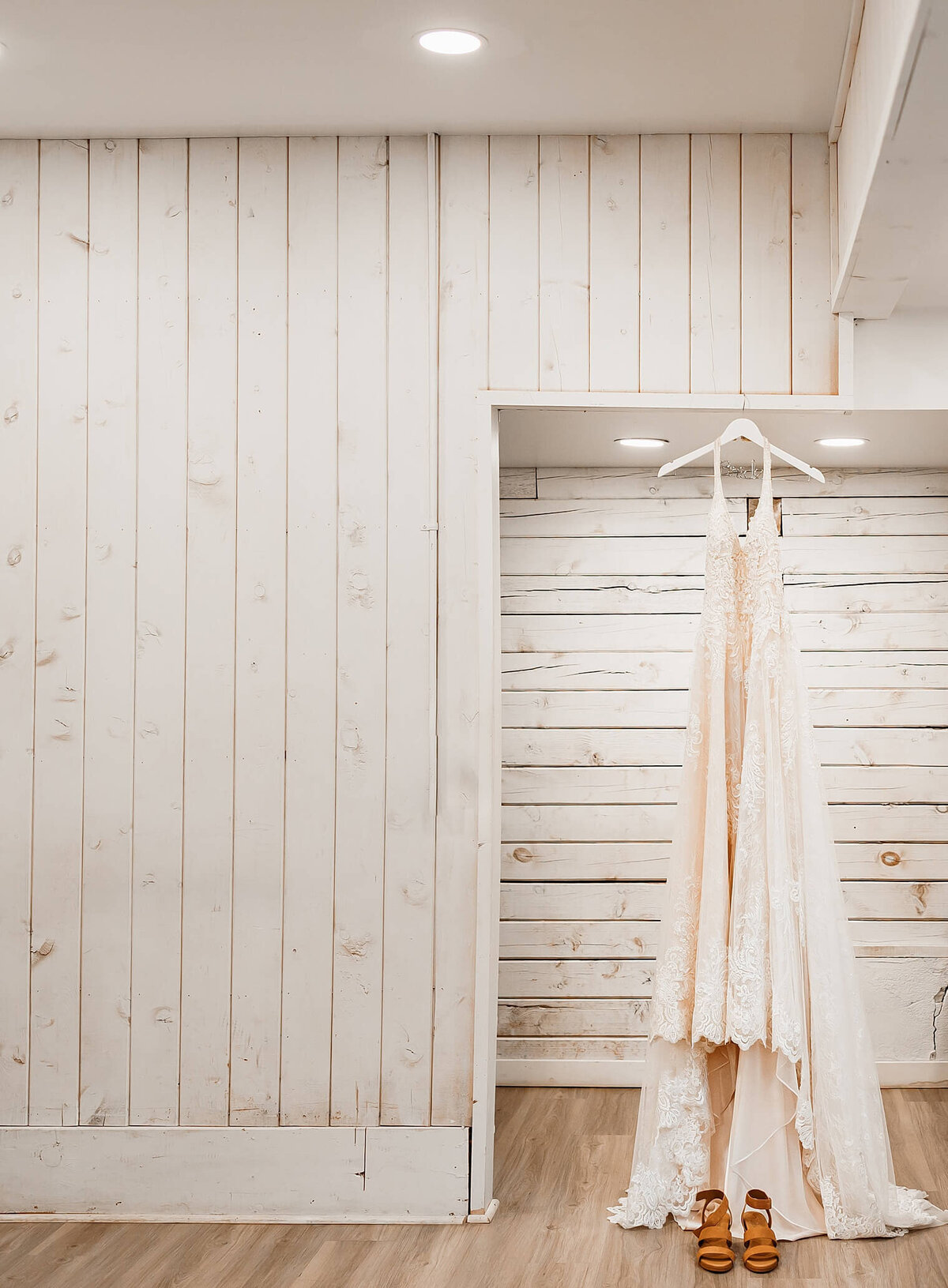 Wedding day in Pinecrest Event Center in Colorado detail image of dress and shoes