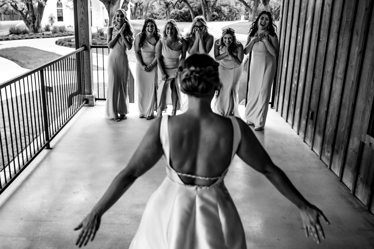 Bride does a First Look with Bridesmaids at The Chandelier of Gruene