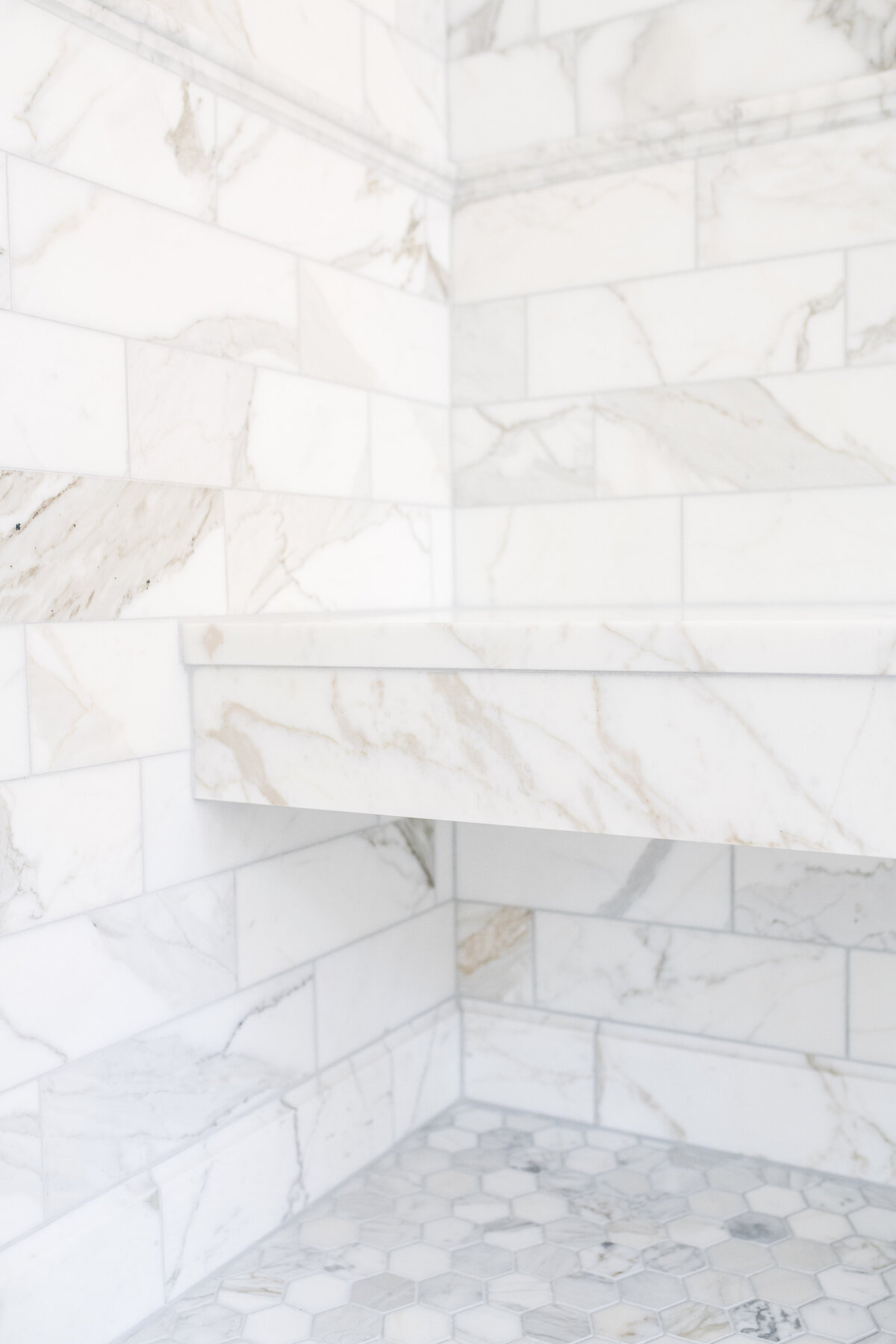 beacon-hill-marble-shower-bench-hex-tile-floor