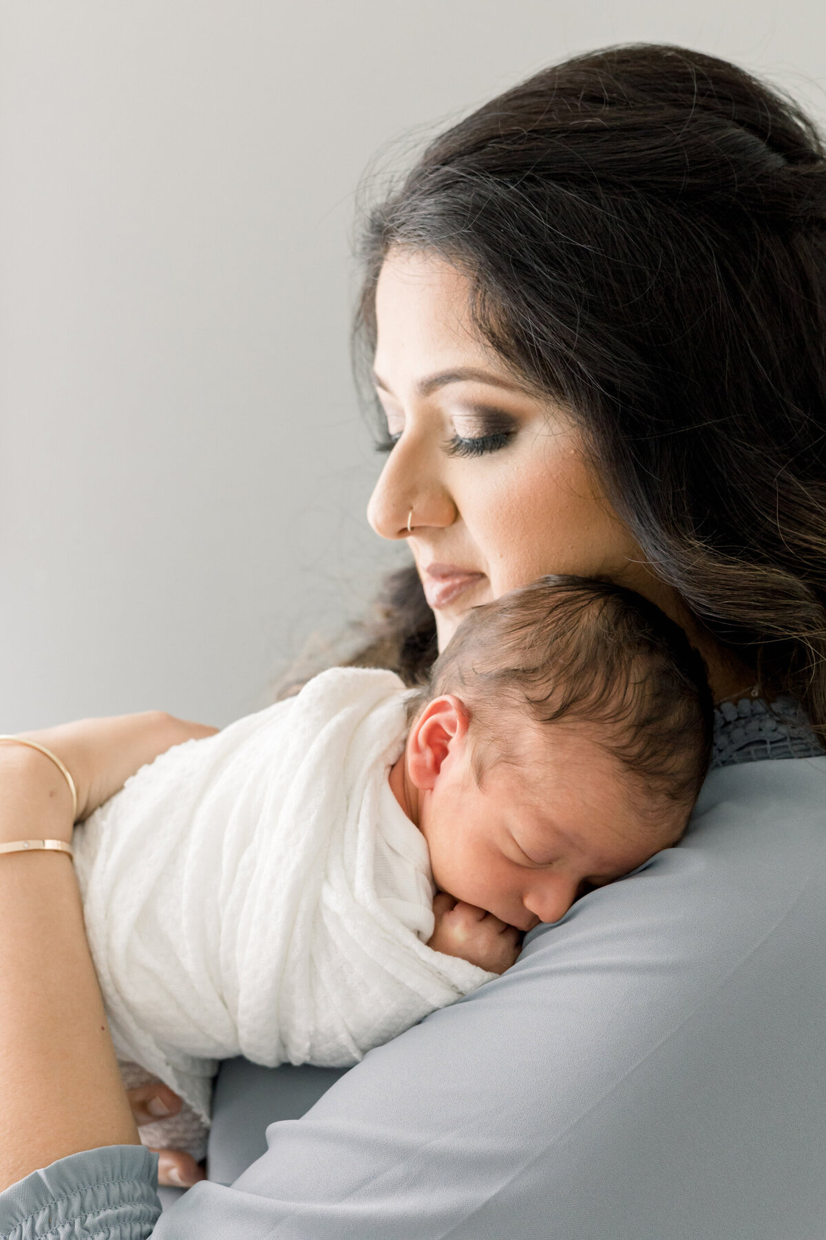 a mom holding her newborn baby
