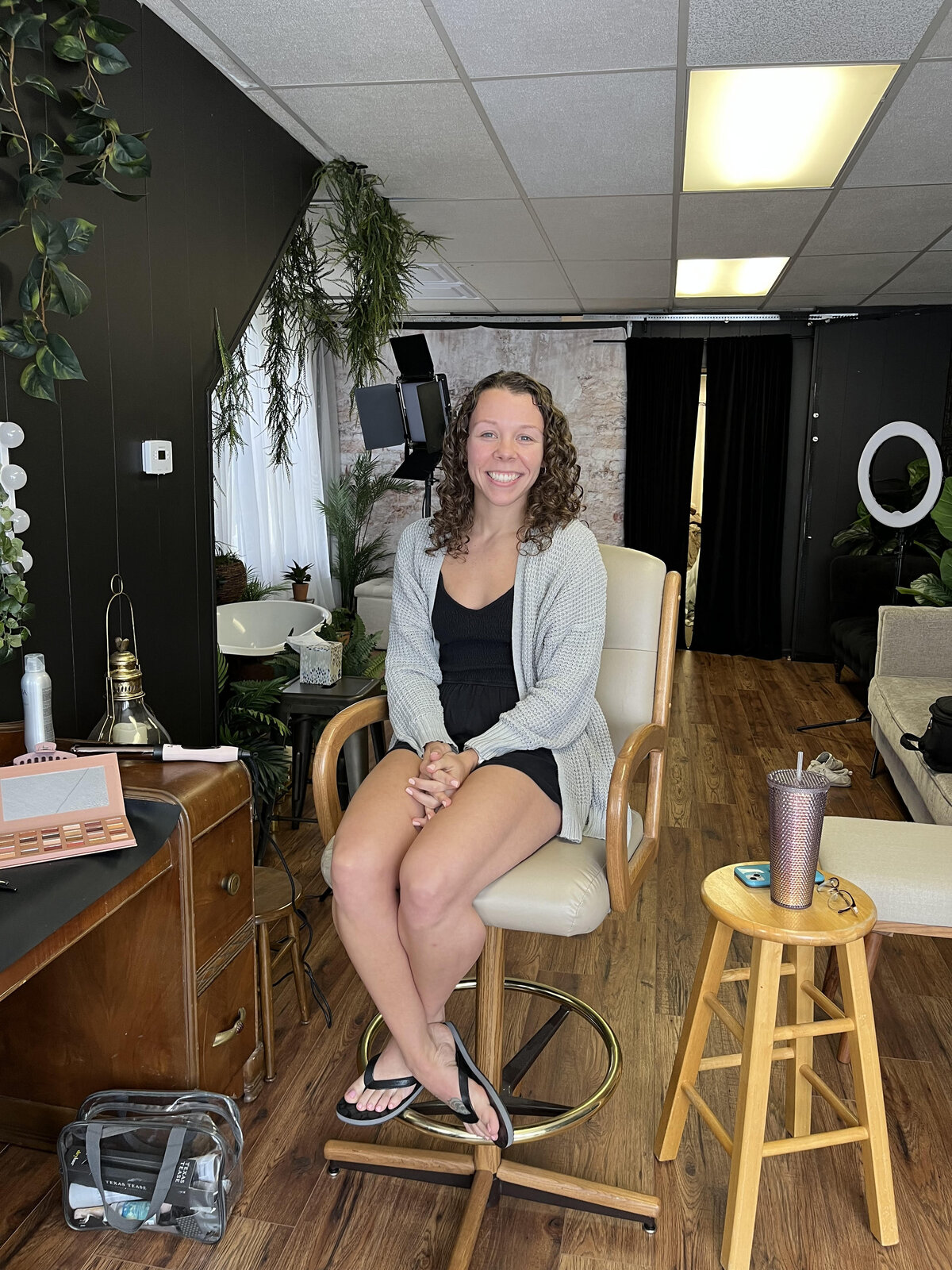 a woman poses in the hair and make up chair