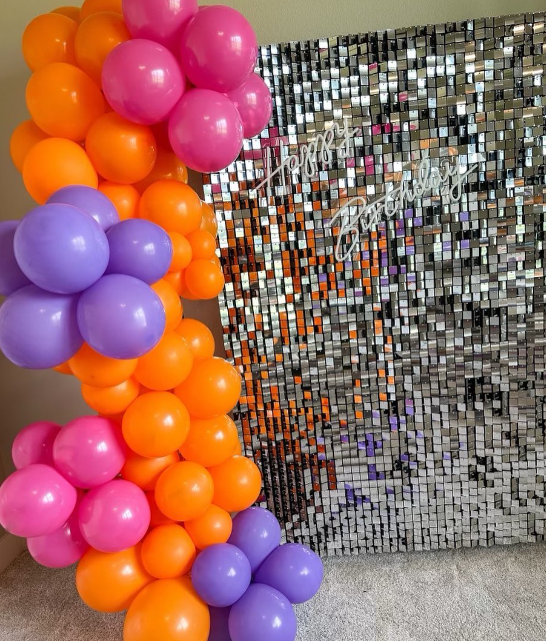 sparkly backdrop with balloons