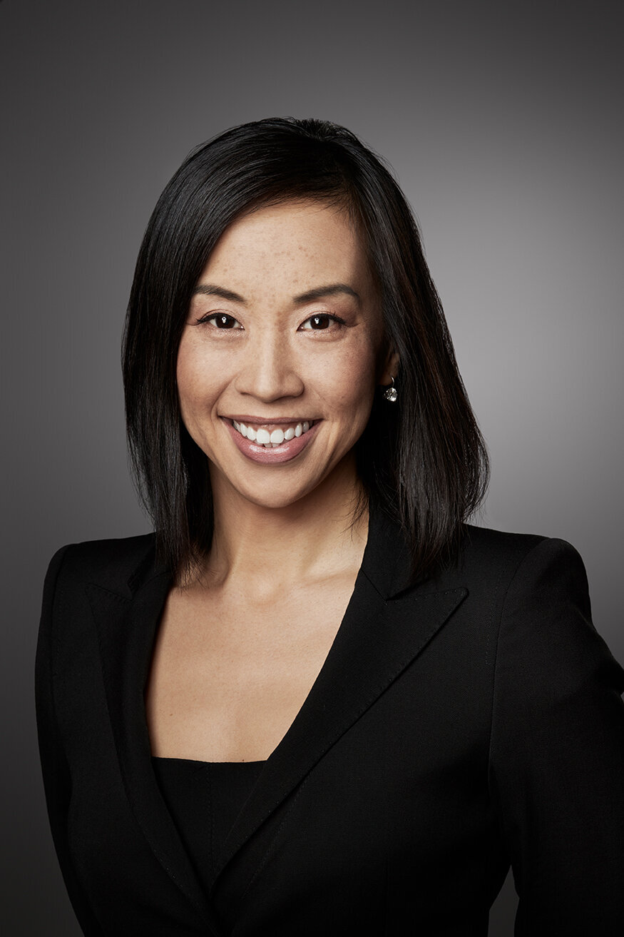Warm and engaging portrait of Justine Cheng, showcasing a friendly demeanor, shot by Ylva Erevall.
