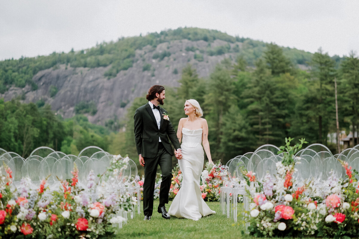 Bride and groom at the end of the aisle in the mountains