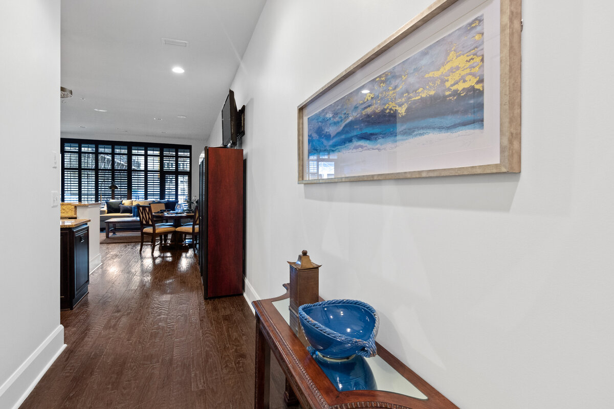Minimalist staging in a entryway to highlight natural light and room dimensions